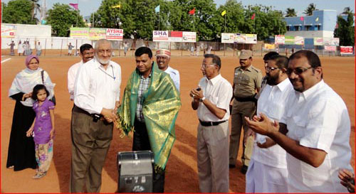 Chief Guest Shri. Ashis Kumar, I.A.S. was honoured with a shawl by Mr. Pallack Lebbe (President - USC) at USC Playground on 30-05-2013